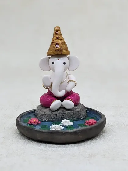 A close-up look at the hand-sculpted details of my Ganesha in a lotus pond. Each element, from the golden crown to the serene expression, is crafted with patience and love.