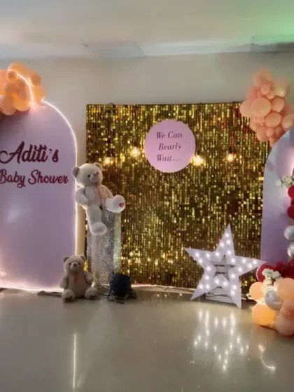A glamorous baby shower for Aditi with the fun message "We Can Bearly Wait". This design combines a gold sequin backdrop with pink, red, and gold balloons and cute teddy bears.