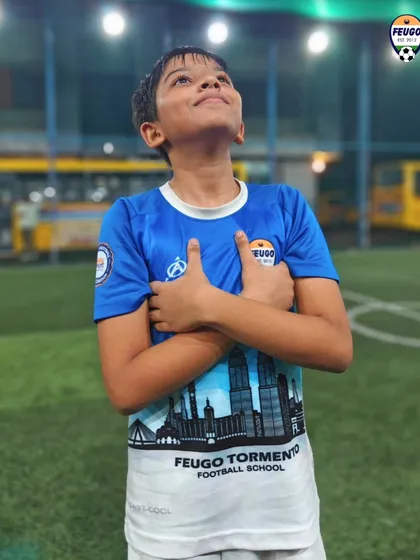 This player looks to the sky, enjoying a moment of celebration on the pitch.