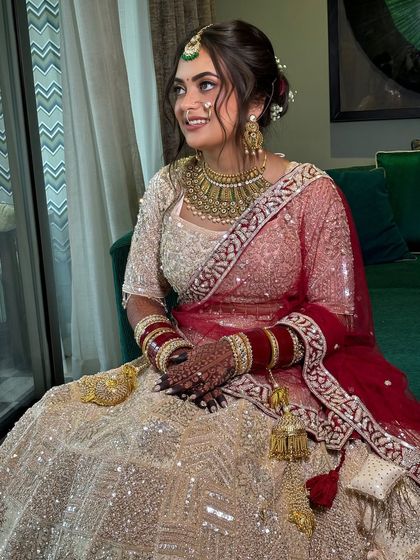 The full view of the bride, showcasing how the elegant updo adds a touch of sophistication to her overall bridal look.