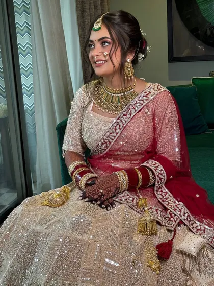 The full view of the bride, showcasing how the elegant updo adds a touch of sophistication to her overall bridal look.