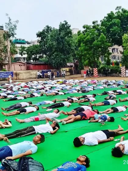 Students practicing Savasana (Corpse Pose) at the end of our Yoga Day session. This pose helps in relaxation and recovery, which is vital for any athlete.