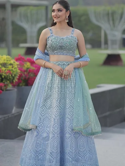 Another beautiful shot of the ice blue lehenga, perfect for a garden or beach wedding. The light colors and delicate embroidery are simply stunning.