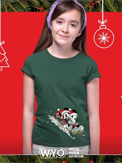 A cute Mickey and Minnie Mouse sledding design on a dark green t-shirt, perfect for a child's Christmas wardrobe.