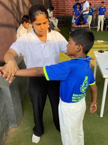 A physio from our team conducts a physical assessment on a young cricketer. We prioritize player well-being with regular check-ups to ensure they are fit to play.