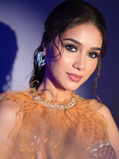 Another angle of the stunning cocktail look. The lighting creates a beautiful shadow, adding to the dramatic and artistic feel.