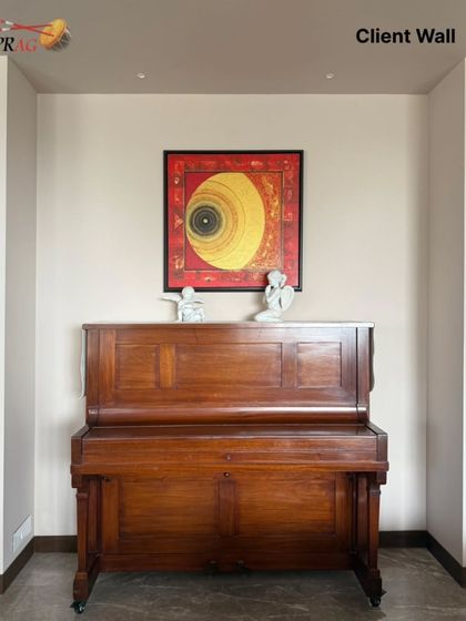 A perfect balance of art and music. This meditative abstract painting is placed in a cozy piano corner, enhancing the room's serene and creative atmosphere. The frame's colors harmonize with the warm wood of the piano.
