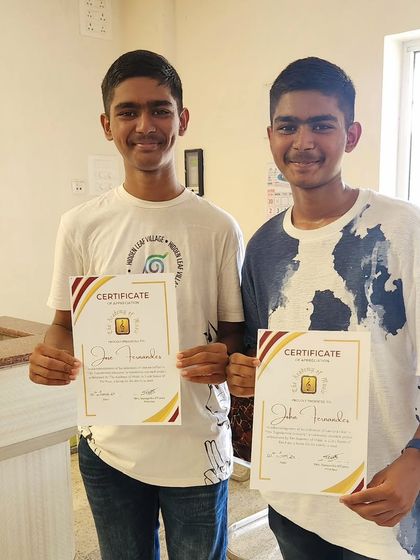 Our talented brother duo, John and Jose, proudly holding their certificates after their energetic performance.