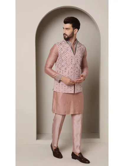 The Mystic Rose bandi set. A rose copper kurta is paired with a bronze jacket featuring a V-cut neckline and sparkling glass bead detailing for a touch of romance.