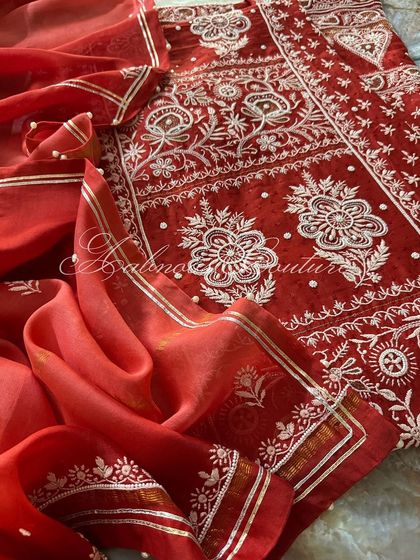 A close-up of the ombré dupatta draped over the detailed kurta.