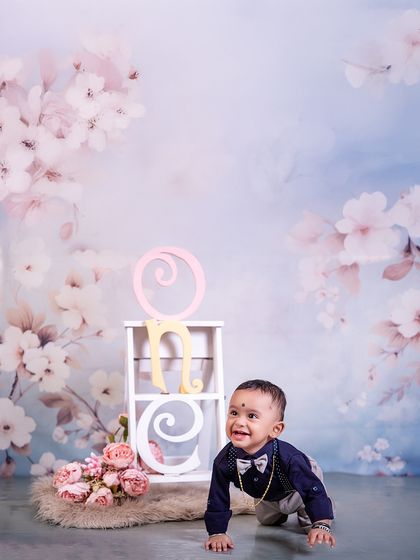 On the move and ready for year two! This action shot captures the crawling birthday boy's excitement and energy, a perfect memory of this active stage.