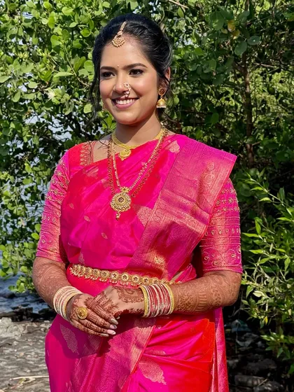 A vision in pink. For this Maharashtrian bride, I created a fresh, glowing look with soft eyes and a statement lip to perfectly balance her vibrant saree and traditional gold jewellery.