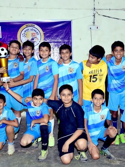 Our Under 12 team celebrating their victory as champions of the Baby League. These competitions are crucial for developing match temperament and skill in our young players.