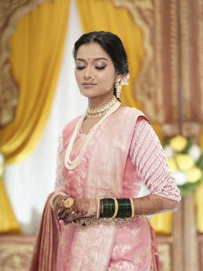 A side view of the beautiful Maharashtrian bride, her mehandi adding to her elegance.