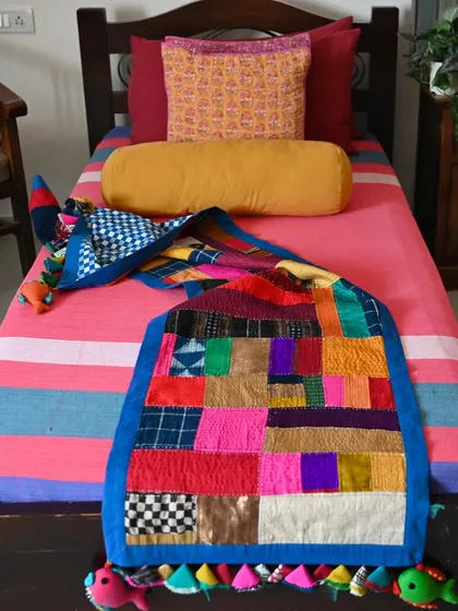This improv quilt is the joyful result of my zero-waste philosophy. It is composed entirely of scrap fabrics and studio waste, with each patch telling its own story of color, texture, and origin.