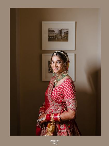A simple and elegant bridal portrait. The bride's checkered red and white blouse adds a unique touch to her traditional wedding look.