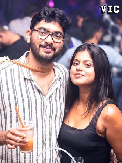 A couple posing for a photo at Sarjapur Social. I love that my gigs become the backdrop for people's happy moments.