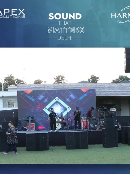 A view of the stage during soundcheck, a critical phase where our audio engineers work with the artists to fine-tune the mix. We meticulously adjust levels for every microphone and instrument to guarantee a balanced and powerful live sound for the performance.