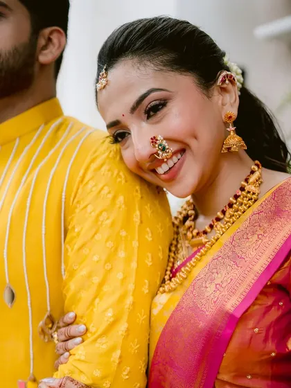 Capturing the pure joy between a couple is what it's all about. For this Maharashtrian bride, I created a radiant and fresh look that complemented her vibrant yellow saree and wouldn't budge through all the smiles and laughter.