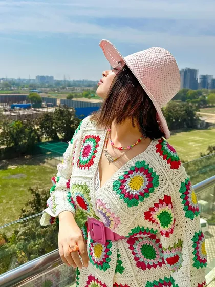 A sun-kissed shot in my crochet outfit. The colors of the cardigan are so bright and cheerful.