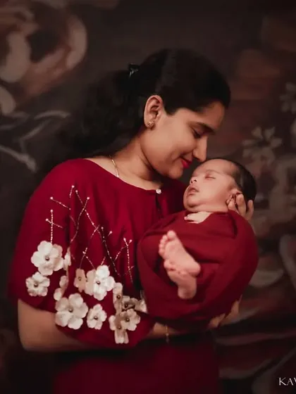 A mother holding her newborn prince. I used soft, warm lighting in the studio to create an intimate and timeless portrait that focuses on their tender connection.