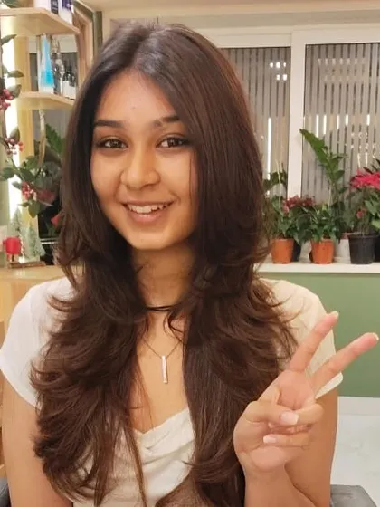 Peace and happiness after a great haircut. She is clearly thrilled with her fresh new look.