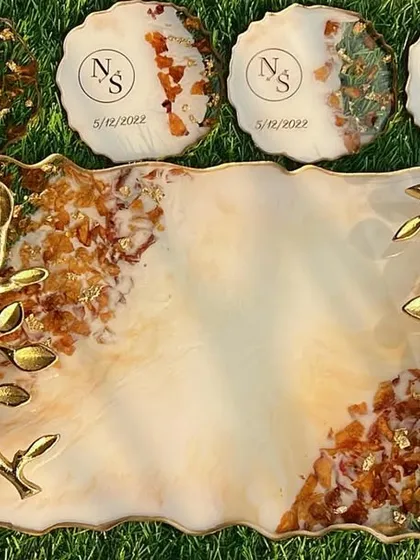This is my specialty, turning your beautiful wedding varmalas into a timeless keepsake. This complete set includes a custom serving tray with elegant gold-leaf handles and eight matching coasters, all preserving the delicate flowers from your special day.