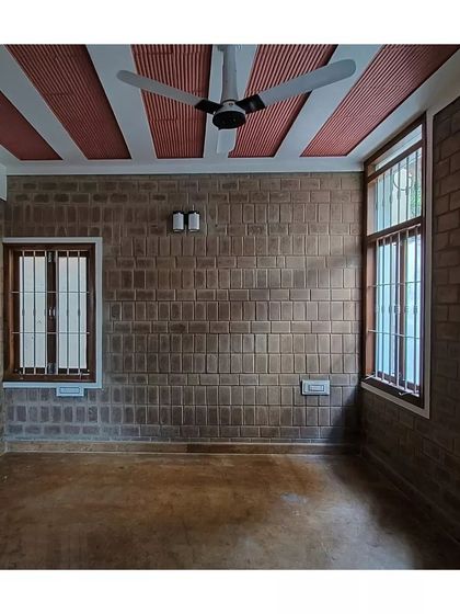 A duplicate of the bedroom with exposed soil cement block walls and a jack arch ceiling.