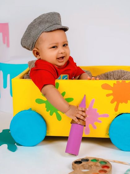 The happiest little artist in his colorful studio. This shot perfectly captures the fun and playful energy of our creative milestone sessions.