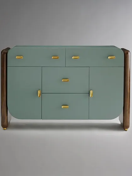 This sleek buffet showcases our mastery of material fusion. A medium sheen lacquer chest in a serene sage green is framed by rich, dark wood sides, all resting on burnished brass plinths. The custom pill-shaped brass pulls add a final touch of refined detail.