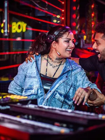 Sharing a laugh with a guest at the console at Toyboy Advant. I love when the crowd gets involved and shares the good vibes with me.