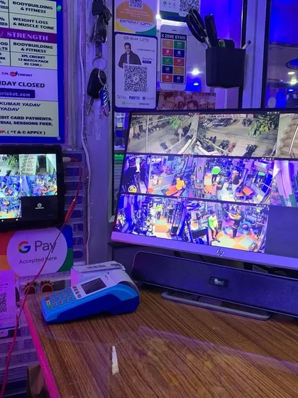 This setup in a gym shows multiple camera feeds on two different monitors for complete coverage of the facility.