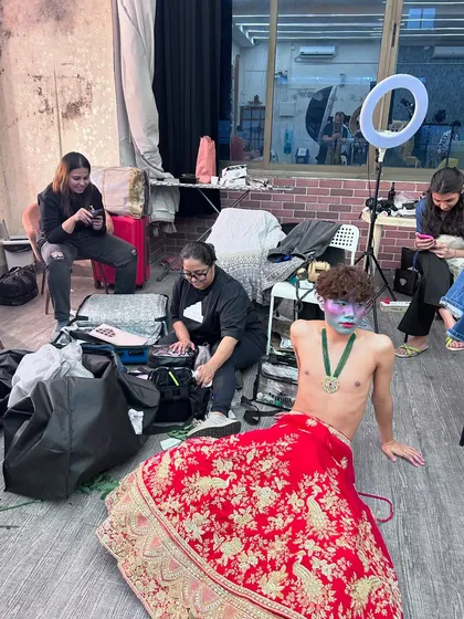 A candid "shoot life" moment, showing the organized chaos behind the scenes of a creative portfolio shoot.