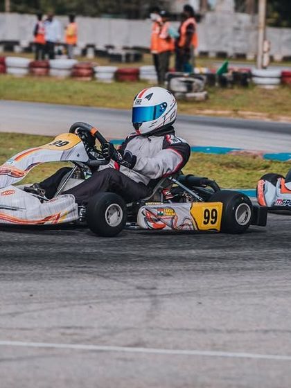A close race between our number 99 kart and a competitor.