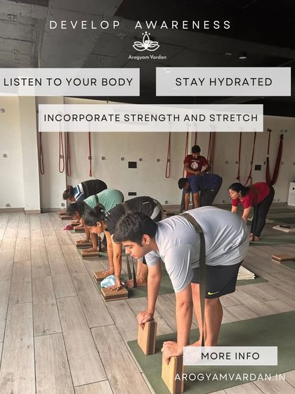 In our classes, we focus on the fundamentals: listening to your body, incorporating both strength and stretch, and developing awareness. Here, students use blocks in Ardha Uttanasana (Half Forward Bend) to lengthen their spines correctly.