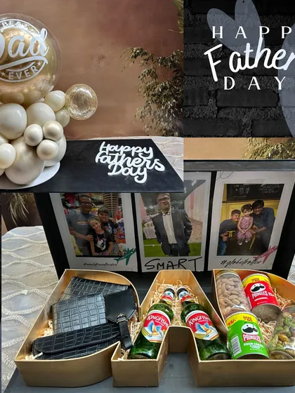We designed the "Dad's Expedition Case" for the dad who is a hero, a globetrotter, and a connoisseur of good things. This monogrammed suitcase opens to reveal personalized travel accessories, his favorite snacks and drinks, and a photo gallery of treasured moments. It's a sophisticated and deeply personal gift.