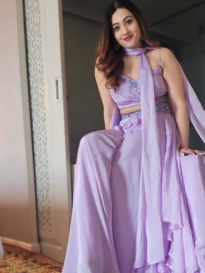 A sitting pose in my lavender outfit, showing its flow and design. Comfort is key when you have to be on your feet for hours, but style is never compromised.