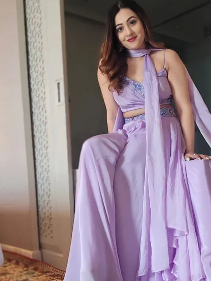 A sitting pose in my lavender outfit, showing its flow and design. Comfort is key when you have to be on your feet for hours, but style is never compromised.