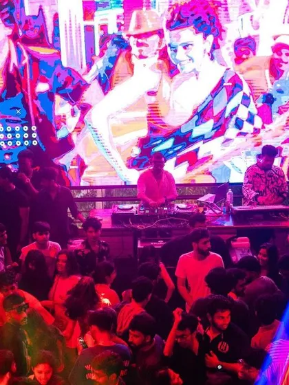 A wide shot of the Gypsy Tower dance floor, with my VJ visuals providing a colorful backdrop.