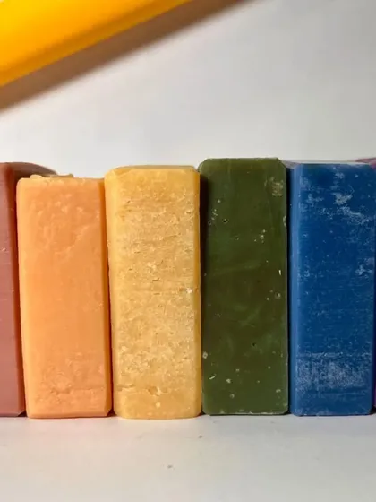 Our all-fruity soap collection, lined up to show their vibrant, natural colors. From green apple to red apple, each bar is a tropical escape.
