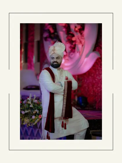 A stylish, full-length portrait of Ayush, his pose confident and his attire perfectly capturing the essence of a modern Indian groom.
