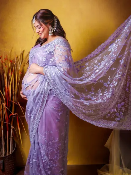 For those who love a traditional look, a maternity shoot in a beautiful saree is a timeless choice. This portrait highlights the intricate details of the fabric and the radiant glow of motherhood.