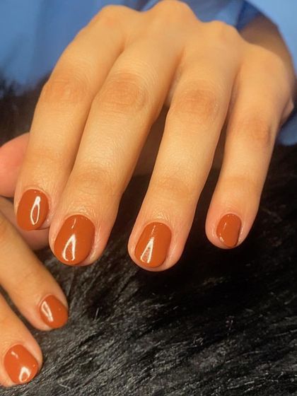 Mani magic! A simple, clean manicure in a warm, rusty brown shade.