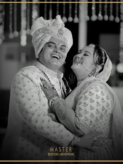 There's nothing more rewarding than seeing a groom beaming on his wedding day. Here, our client Mihir looks joyous and regal in a custom-designed off-white sherwani, perfectly capturing the happiness of the moment.