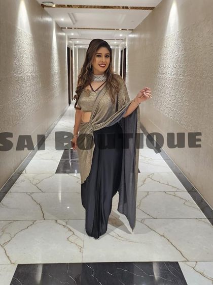 Another view of the drape saree, highlighting the knot detail and the beautiful fall of the fabric.