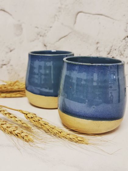 A pair of my blue ceramic tumblers. These can be safely used in dishwashers and microwaves, but I always recommend handling them with care to ensure they last.