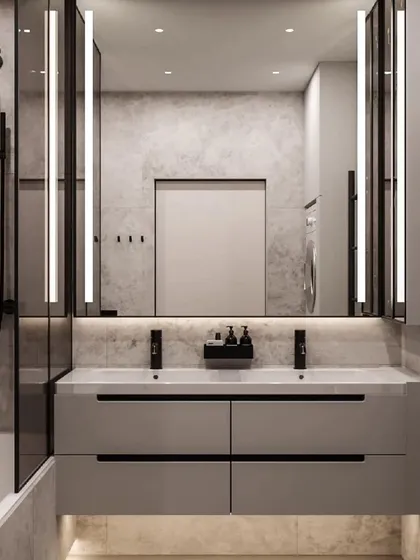 A modern bathroom with a large backlit mirror and a floating double vanity. The design is clean, spacious, and perfect for a master ensuite.