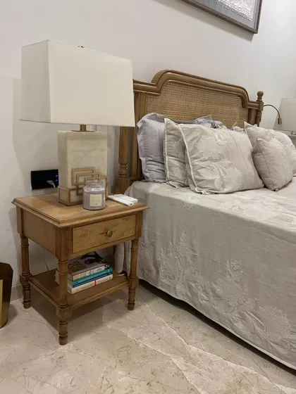 A close-up of the matching oak nightstand for the French-style bed.