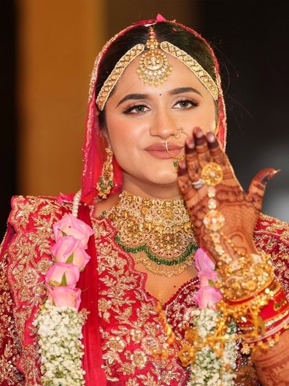 A candid, happy moment. The bride's natural-looking makeup ensures she looks like herself, just with an added bridal glow.