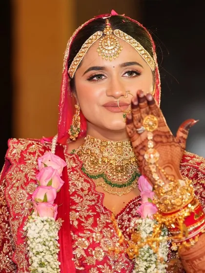 A candid, happy moment. The bride's natural-looking makeup ensures she looks like herself, just with an added bridal glow.